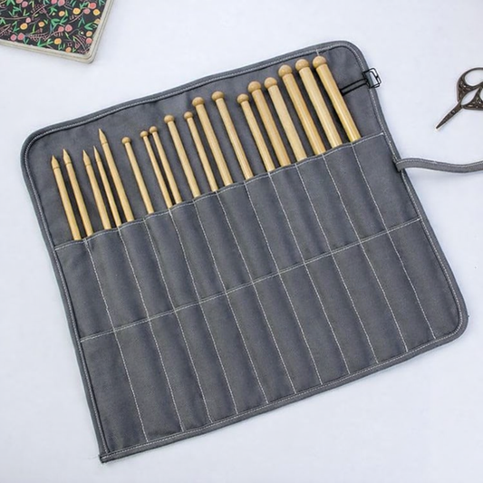 Canvas needle roll bag unrolled showing individual needle pockets