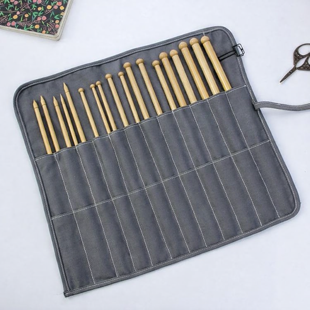 Canvas needle roll bag unrolled showing individual needle pockets