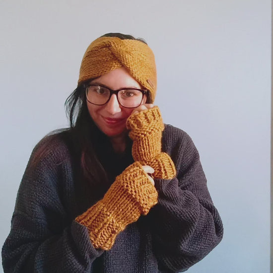 Slide video of a women posing differently with her matching gold ear warmer and fingerless gloves on 